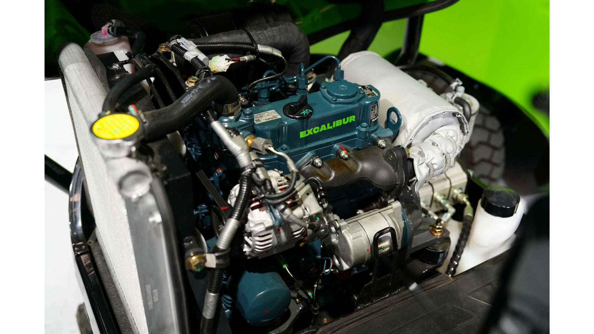 Close-up view of an Excalibur engine, showcasing detailed components and vibrant colors in a sleek design.