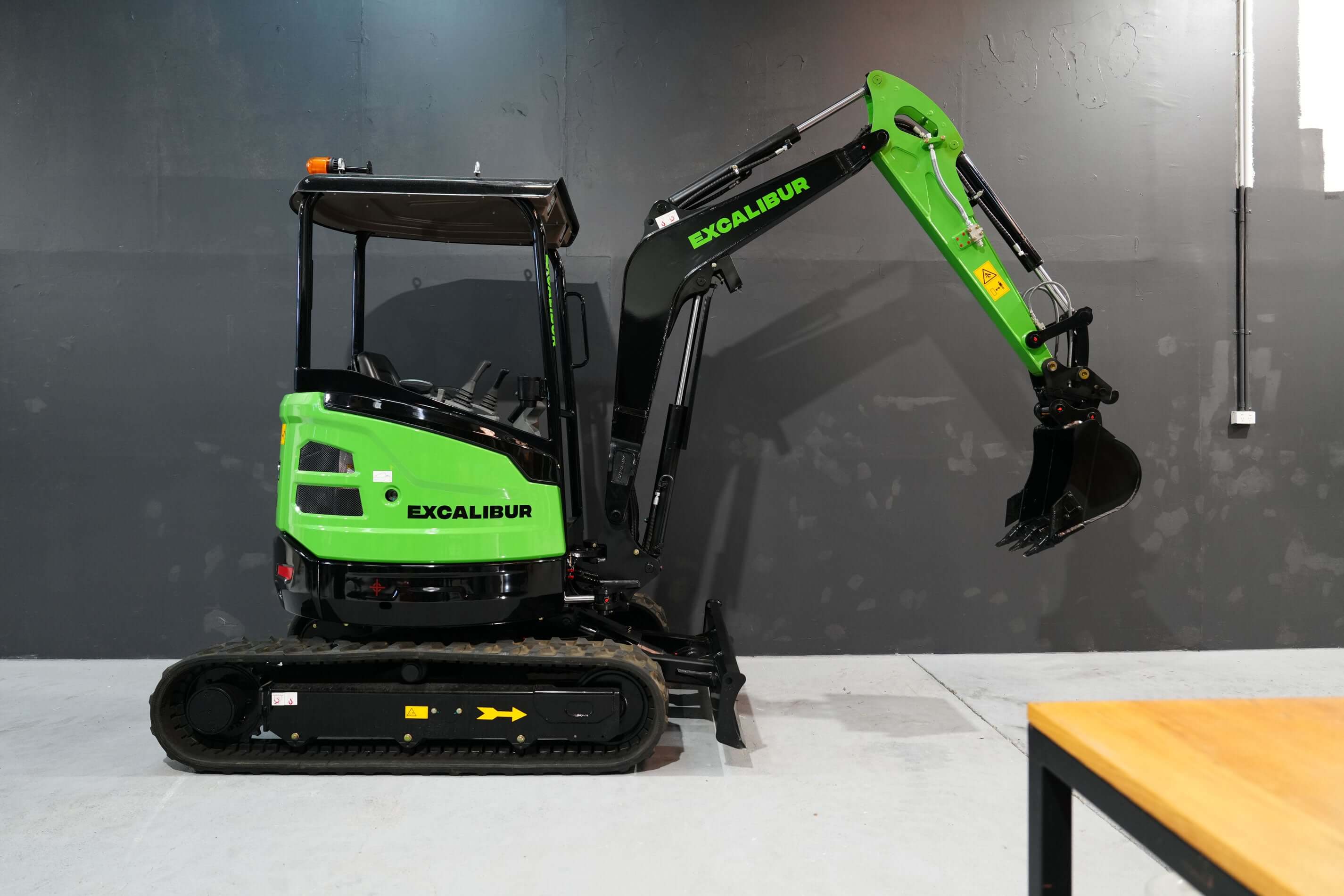 Excalibur 2.7 Tonne Excavator showcasing heavy-duty performance and Kubota power in a modern setting.
