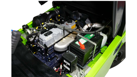 Close-up view of a forklift engine showcasing its components, including the battery and cooling system.
