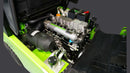 Close-up view of a green engine compartment showcasing the internal components and machinery.