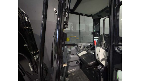 Interior view of the 3.8 Tonne Excavator cabin showcasing controls and operator seat.